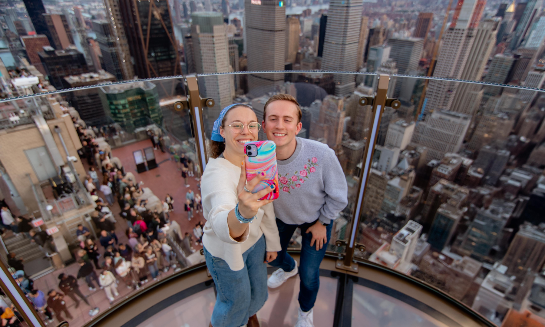 Two people taking a selfie on SKYLIFT at Top of the Rock