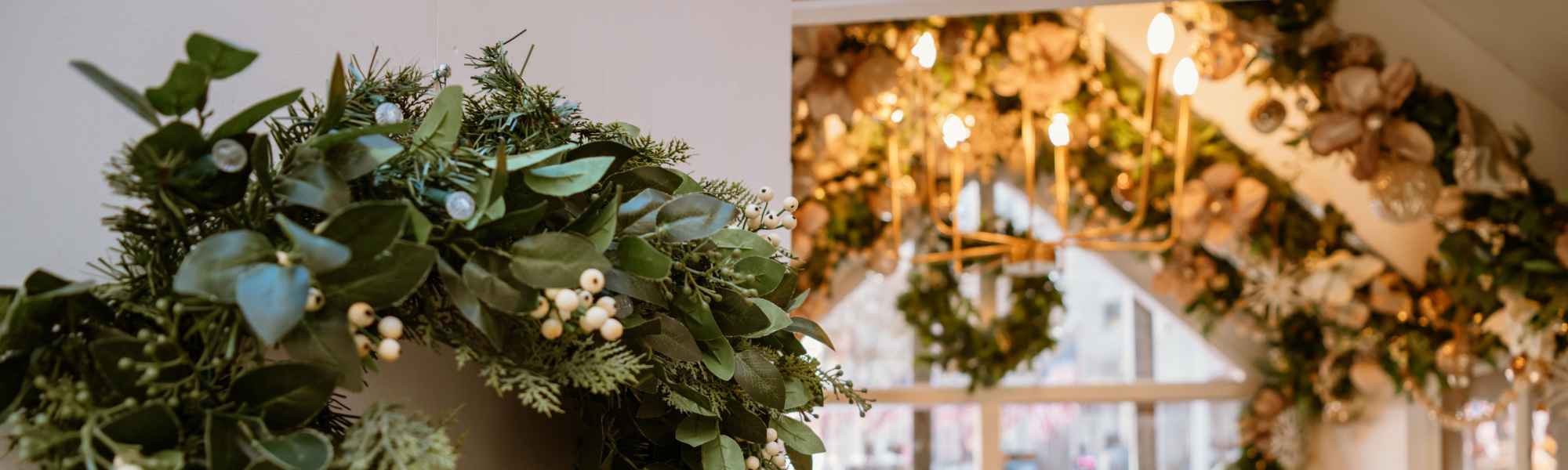 A wreath on a door and the inside of a chalet