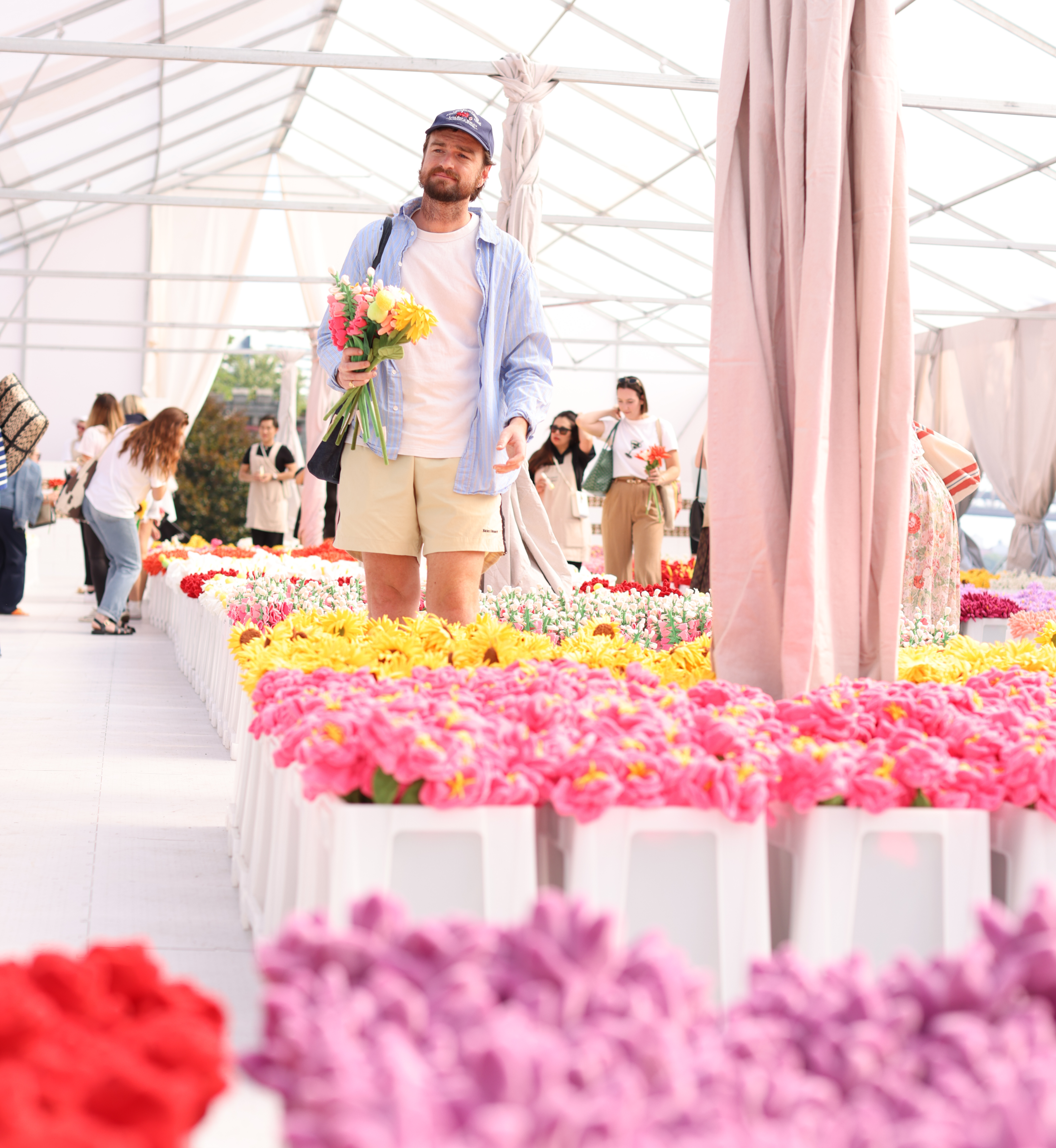 Person picking flowers at artist Cj Hendry's Flower Market