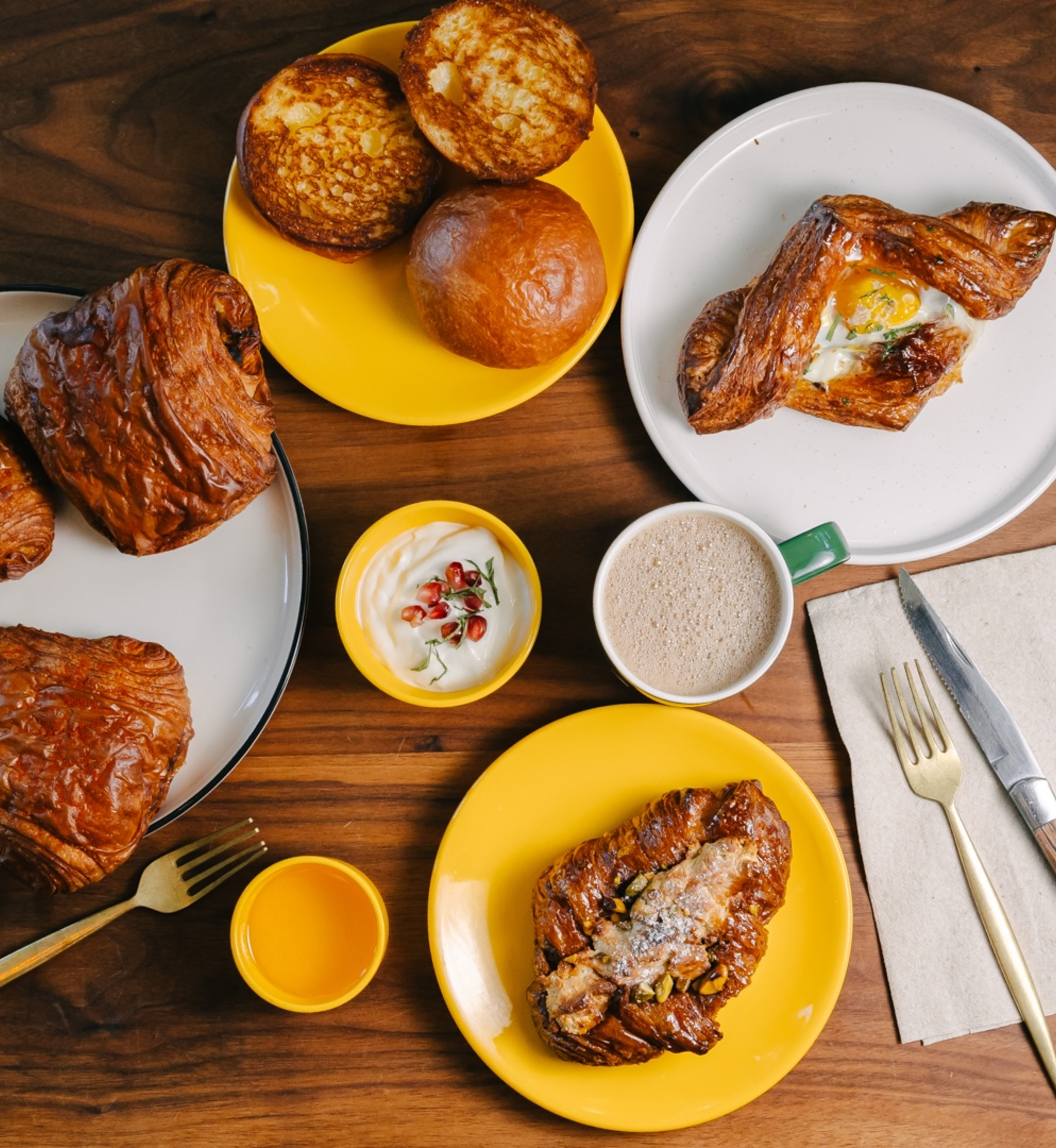 A table with four plates of pastries from INDAY at Rockefeller Center