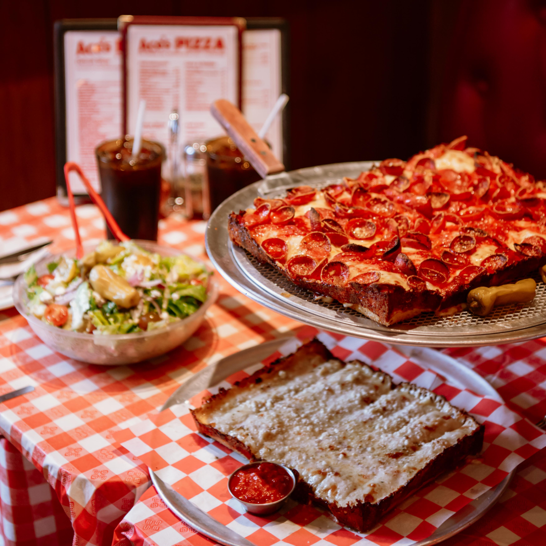 A pizza, a salad, breadsticks, and drinks from Ace's Pizza at Rockefeller Center