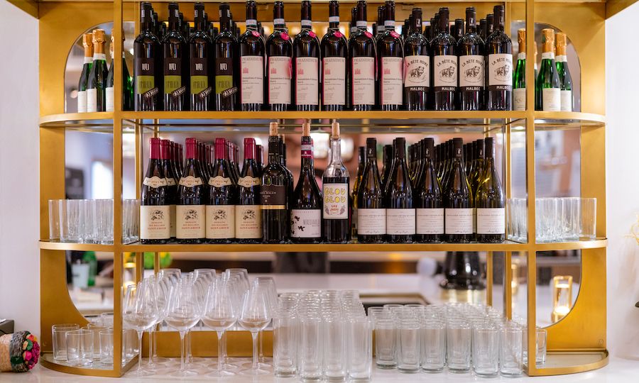 Bottles of wine and glassware on display at The Tipsy Baker at Rockefeller Center
