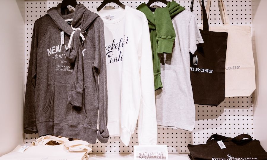 Sweaters and totes on display at the Top of the Rock Gift Shop