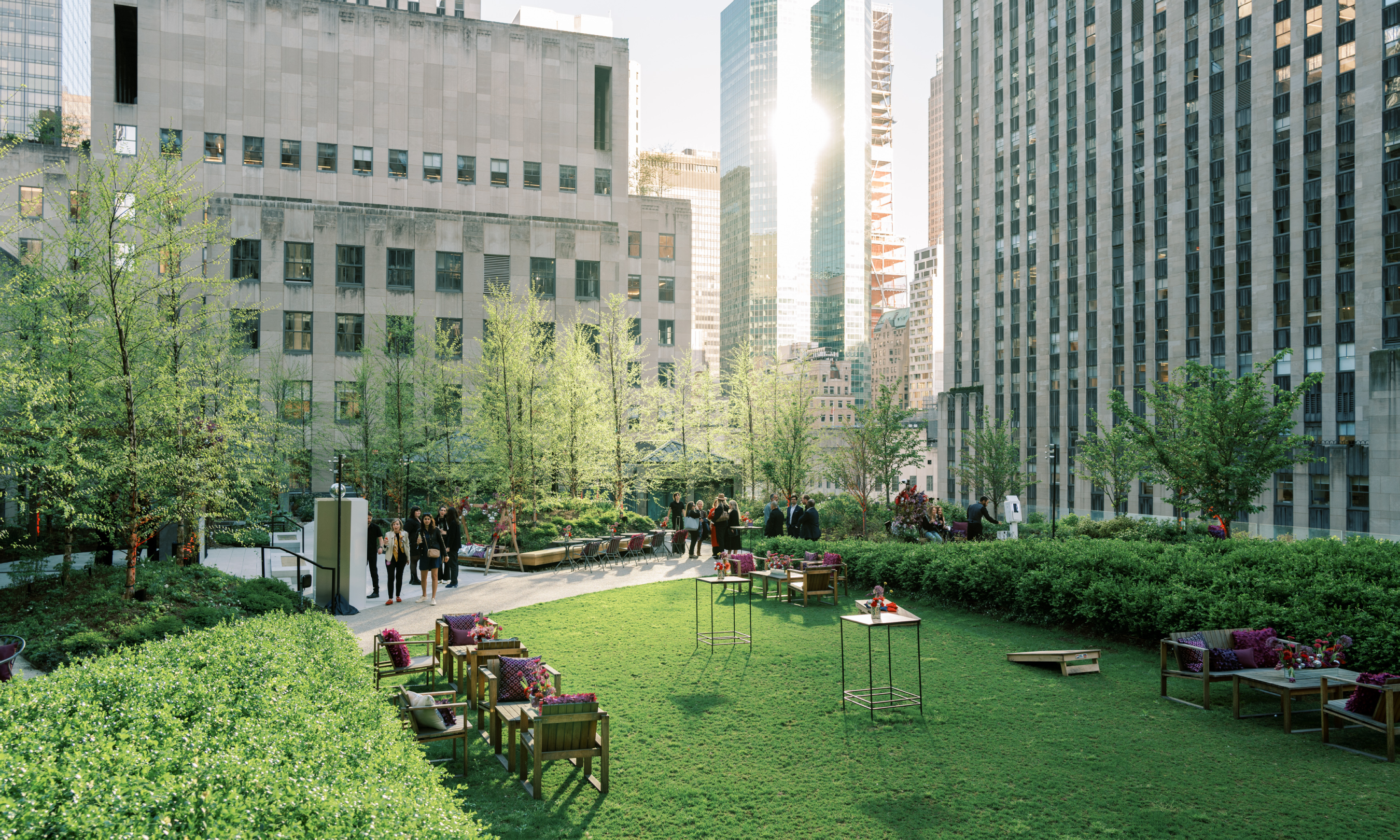 High-top tables and lounge seating on the lawn at Radio Park