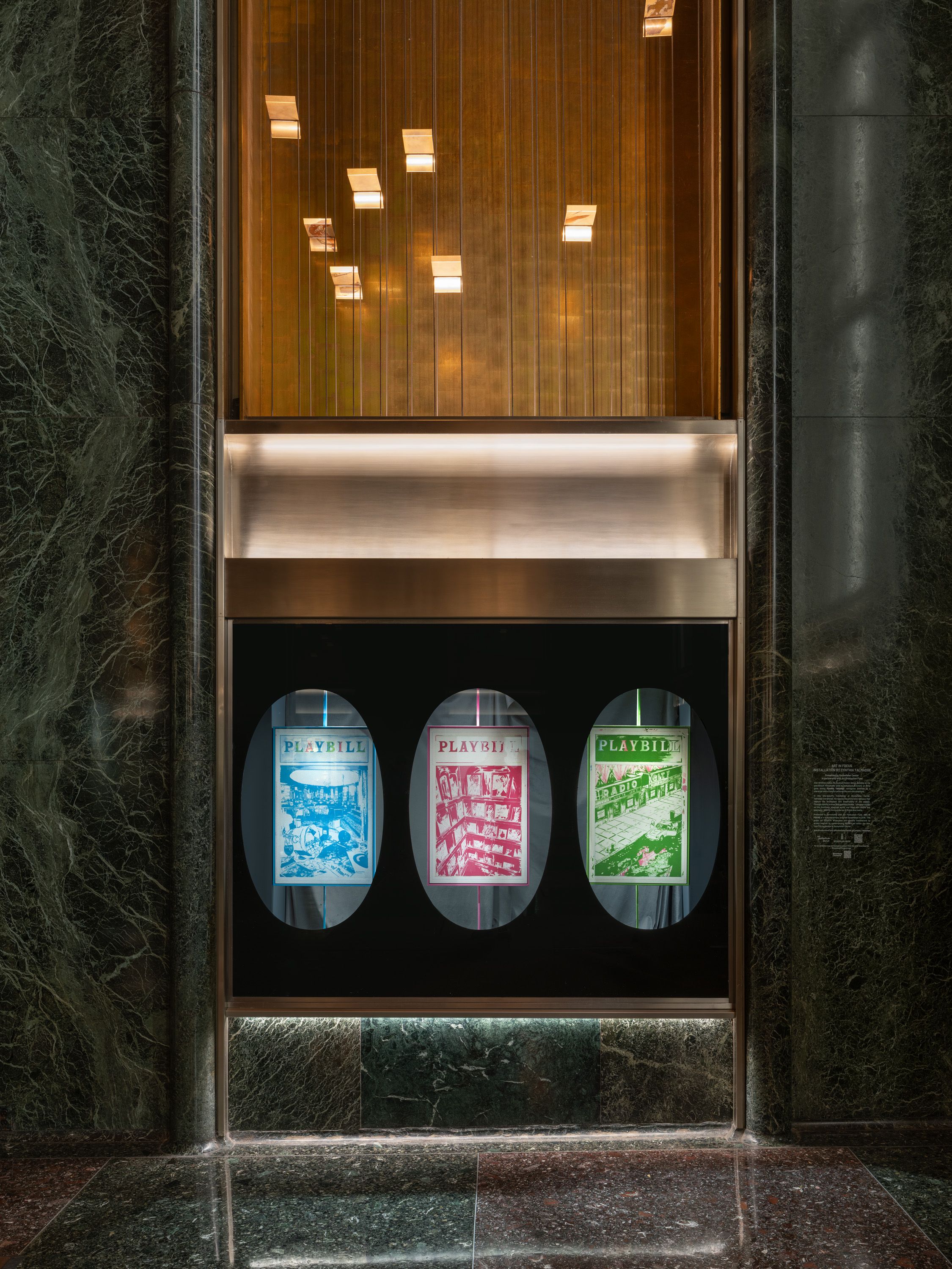 Vitrine with three playbill artwork