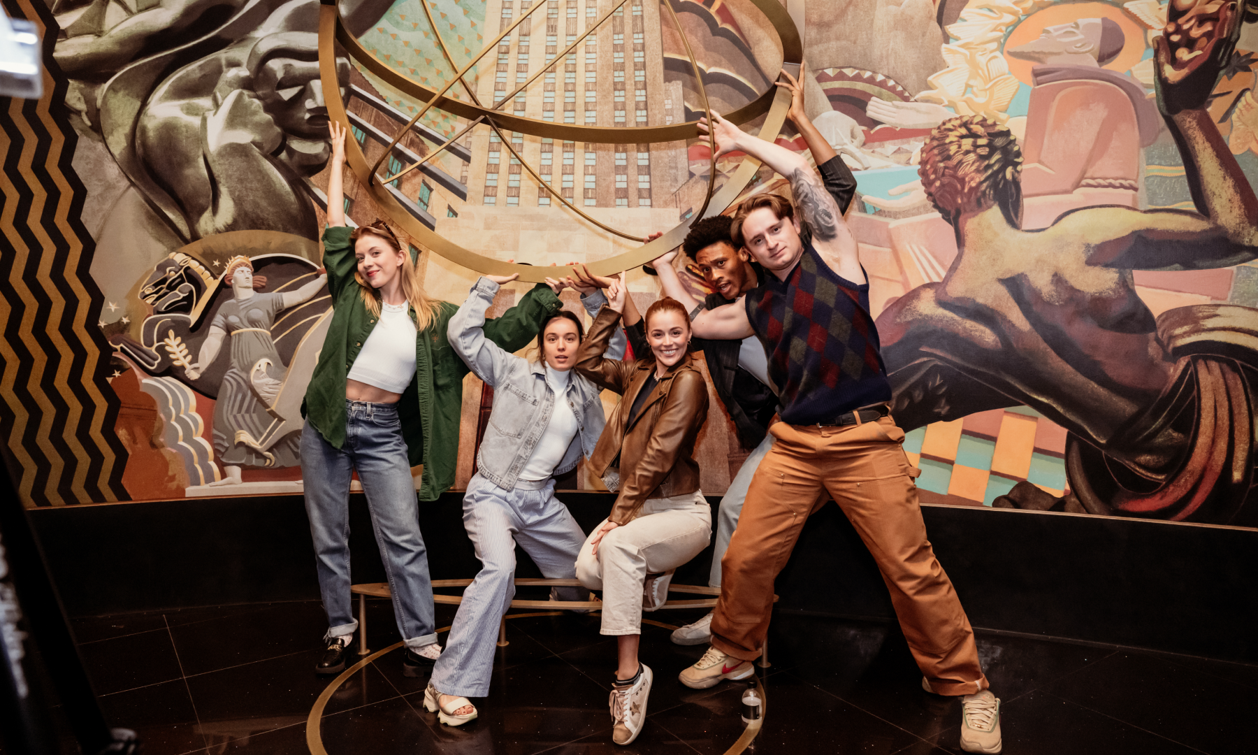 The cast of Broadway's "The Outsiders" inside the Welcome Gallery at Top of the Rock