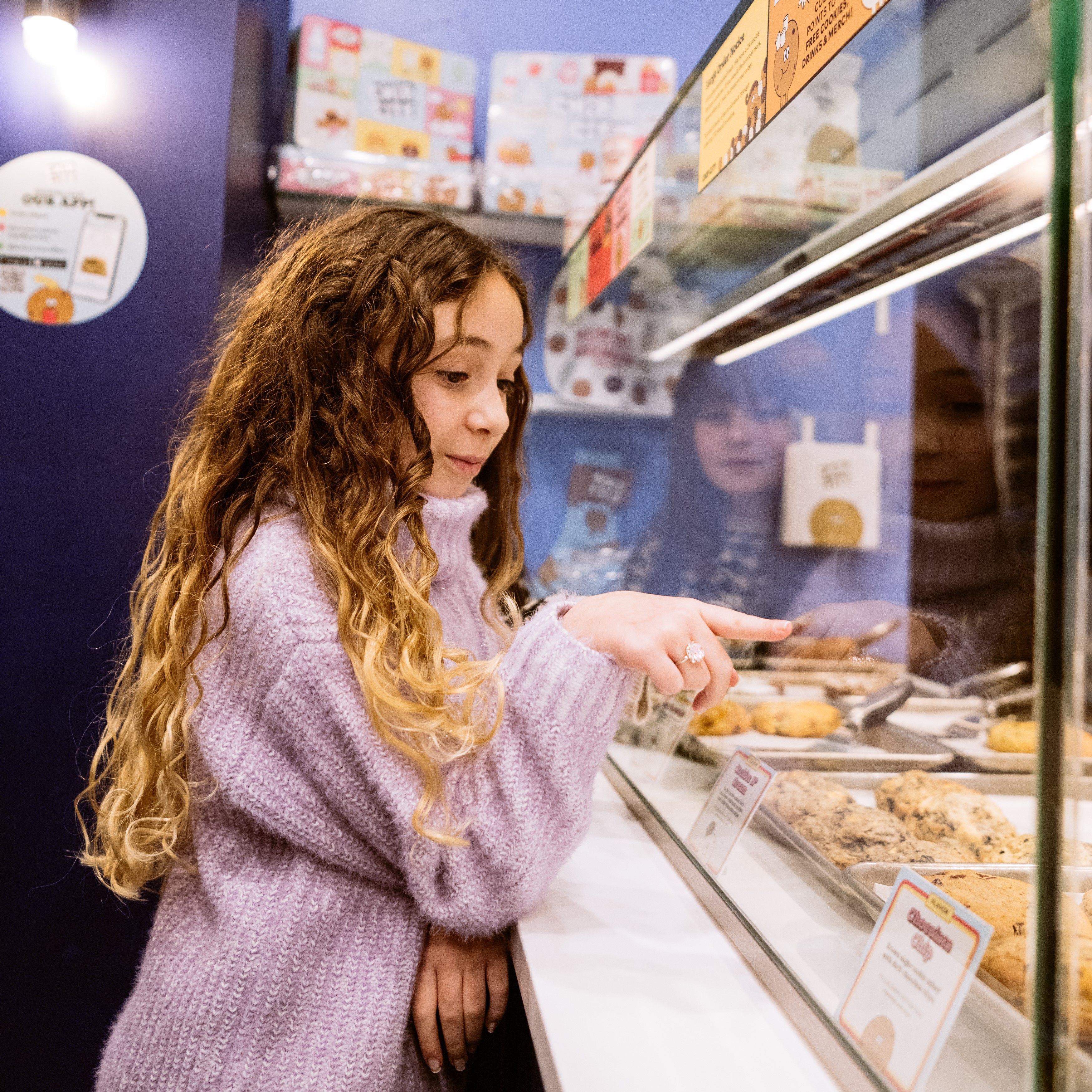 Girl choosing a cookie from Chip City at Rockefeller Center