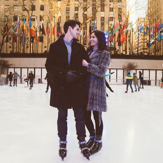 A couple skating on The Rink at Rockefeller Center