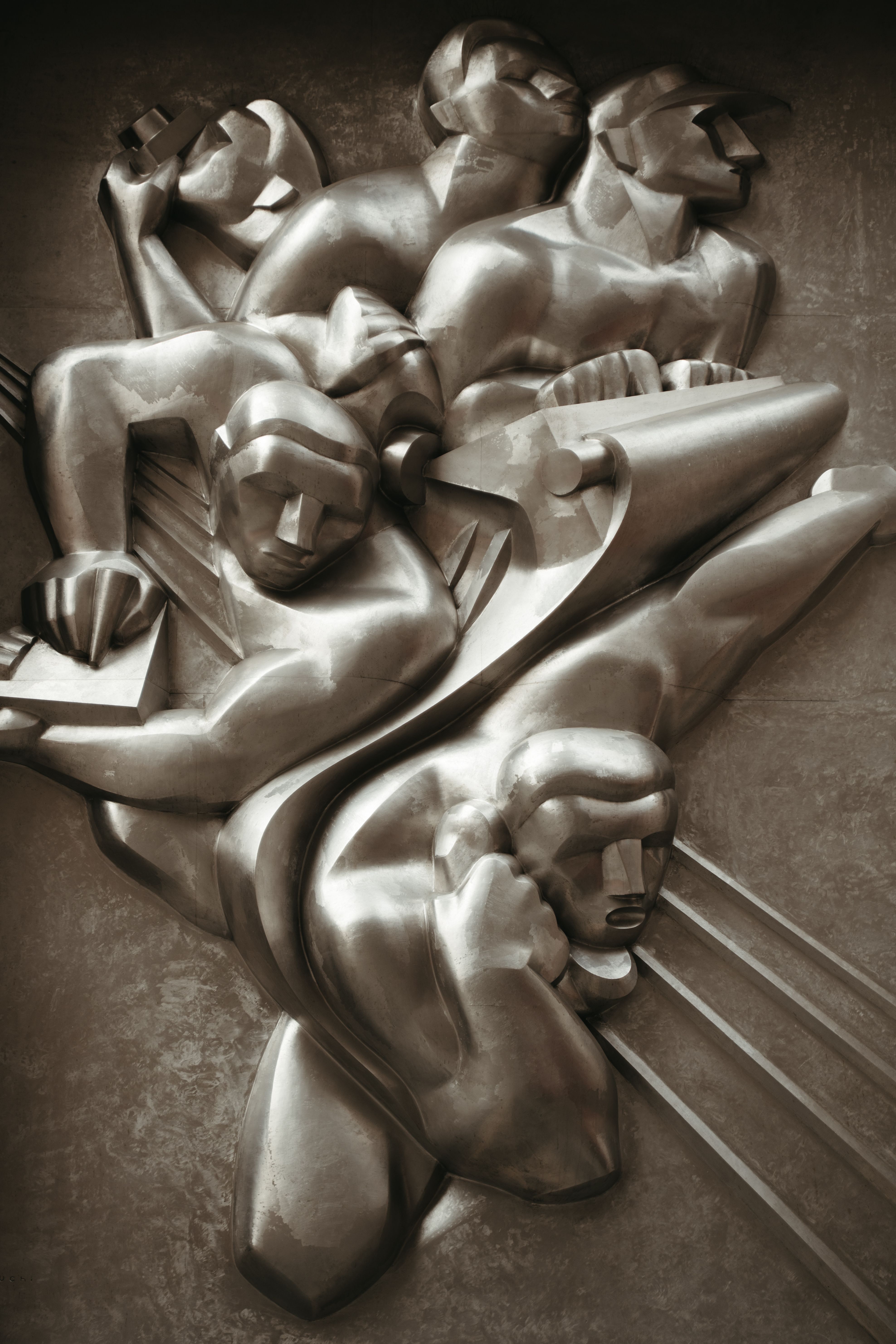 News, a plaque sculpture by Isamu Noguchi above the 50 Rockefeller Plaza main entrance.