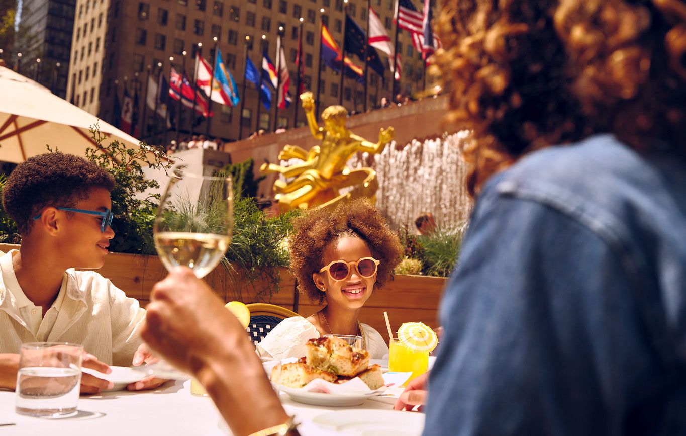 family enjoying outdoor dining at Rockefeller Center