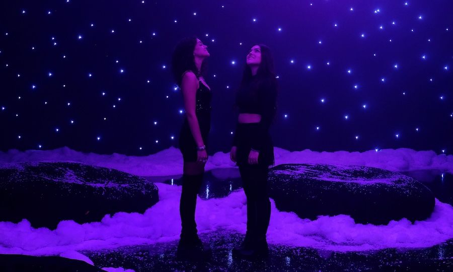 Two people at HERO's "The Winter Forest of the Northern Lights"