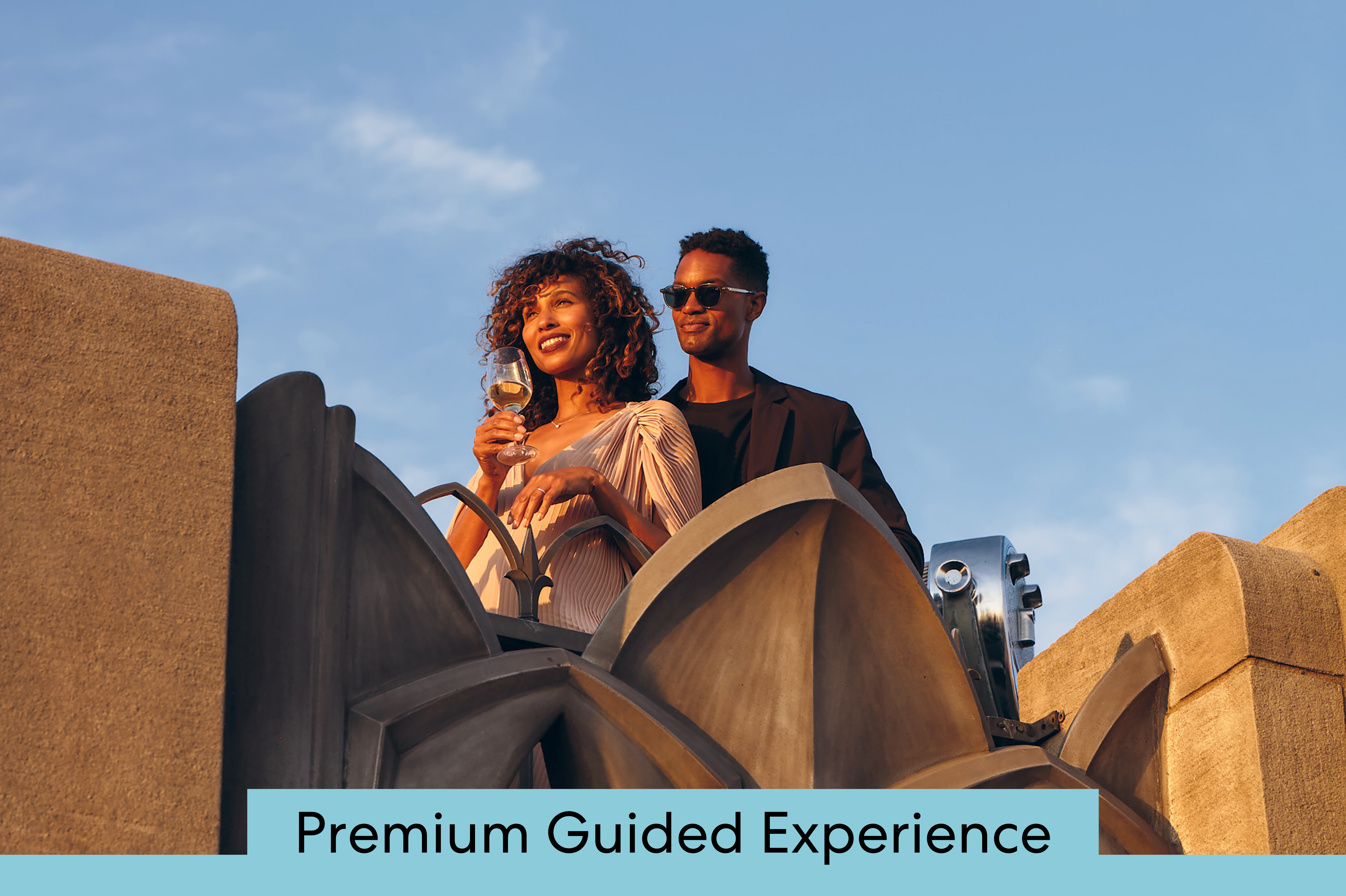 two people at sunset in front of the city