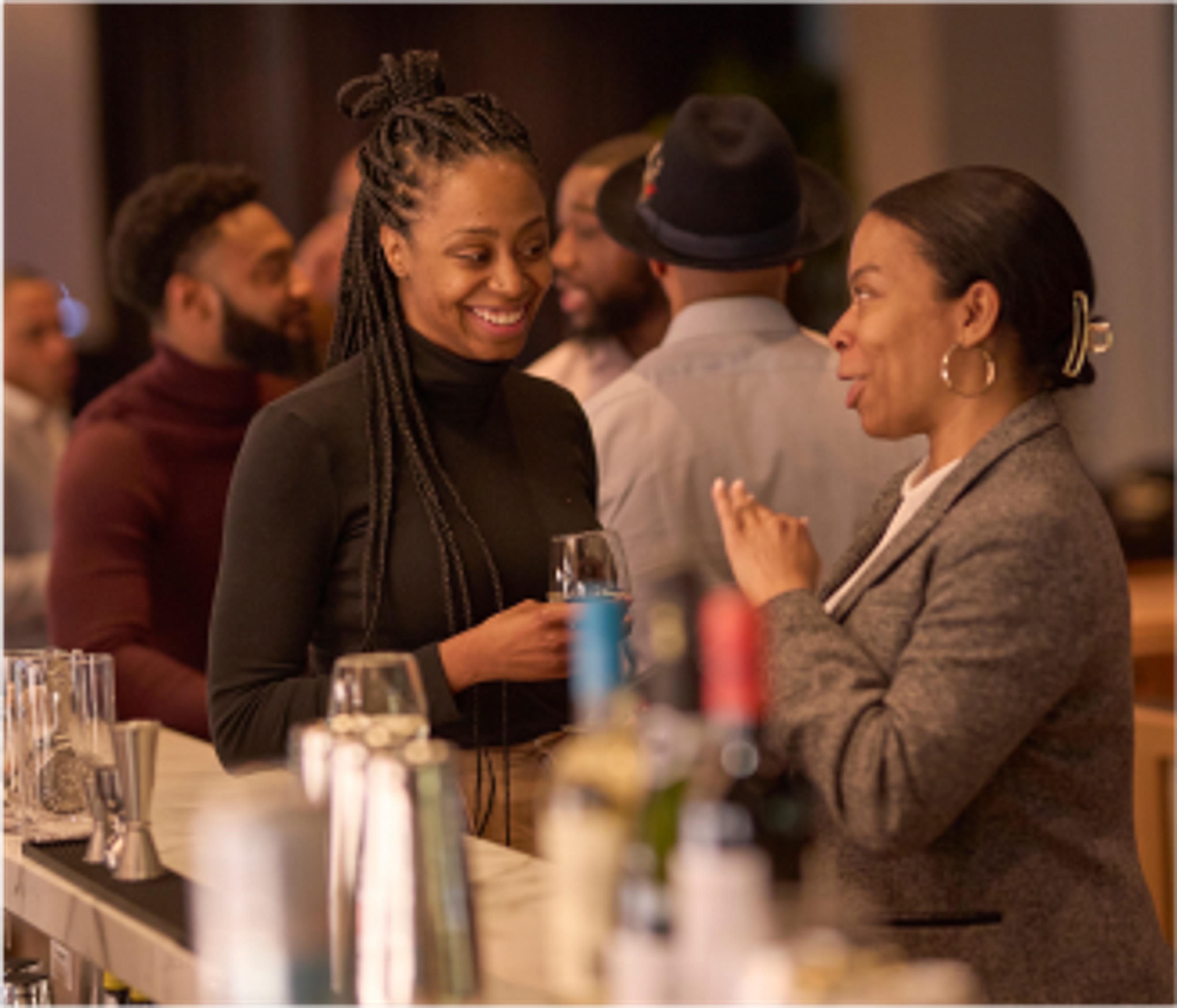 smiling members connecting during an exclusive experience