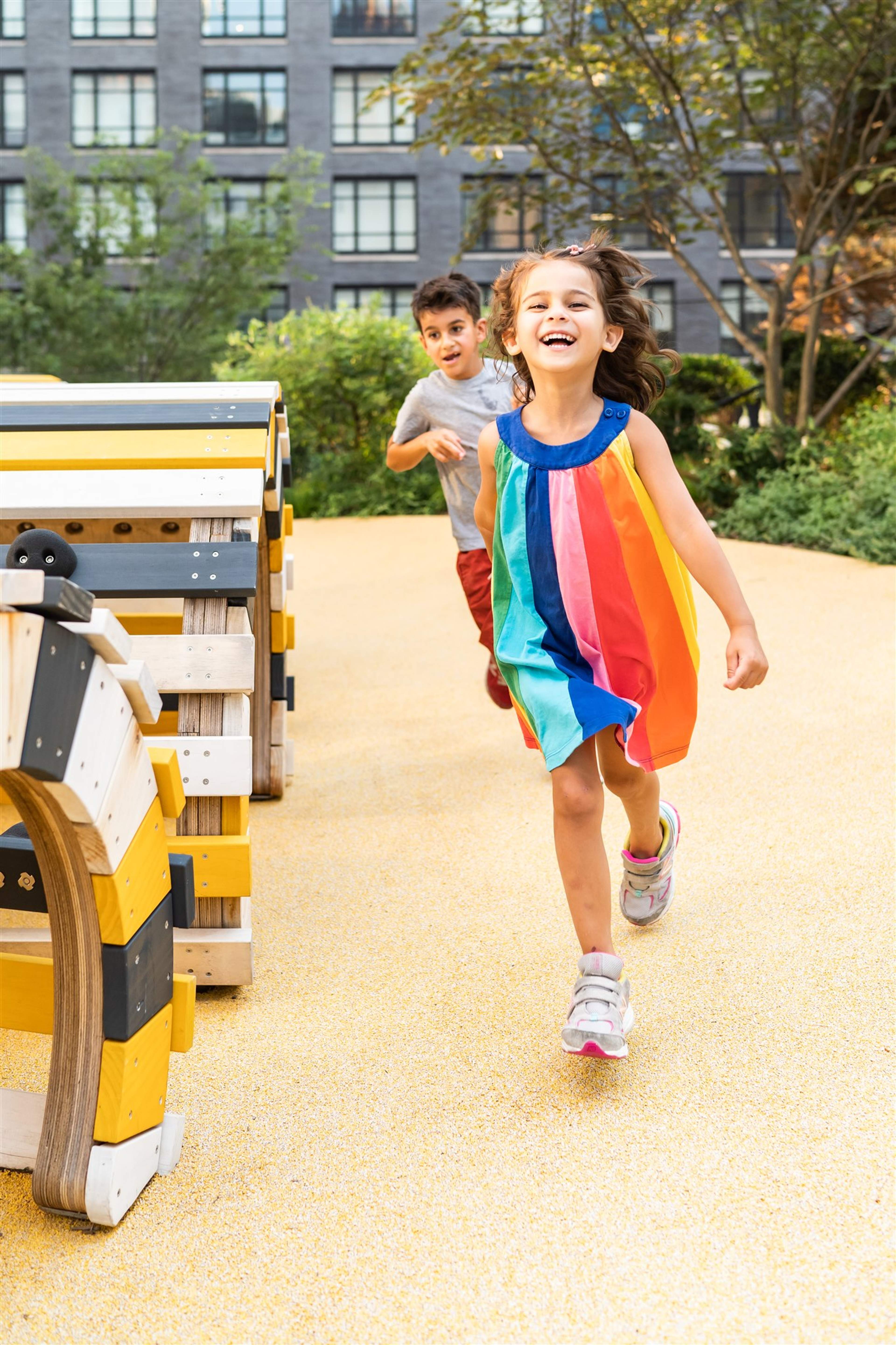 Boy and Girl running in playground