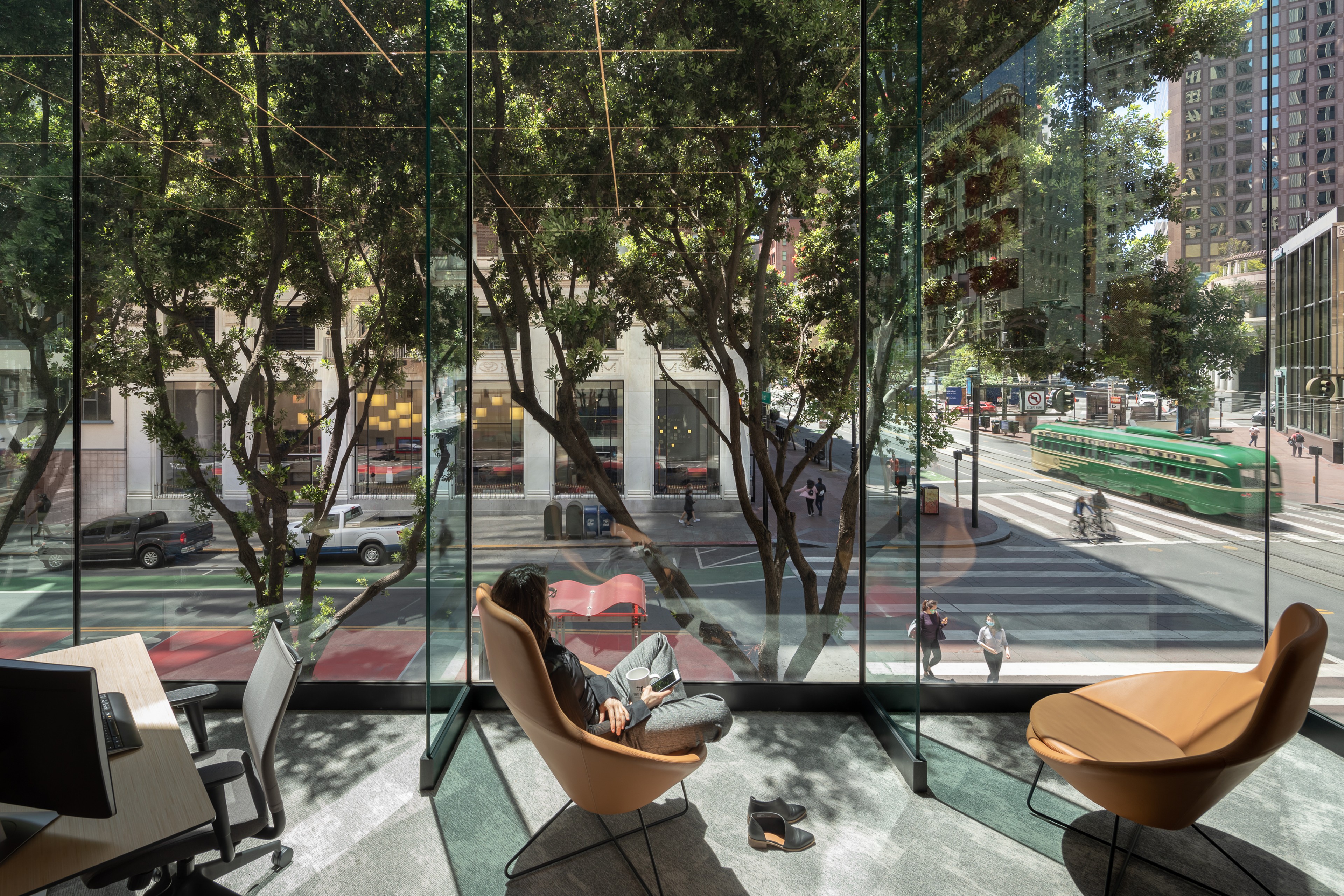 Interior view of 595 Market with chairs and wall of windows