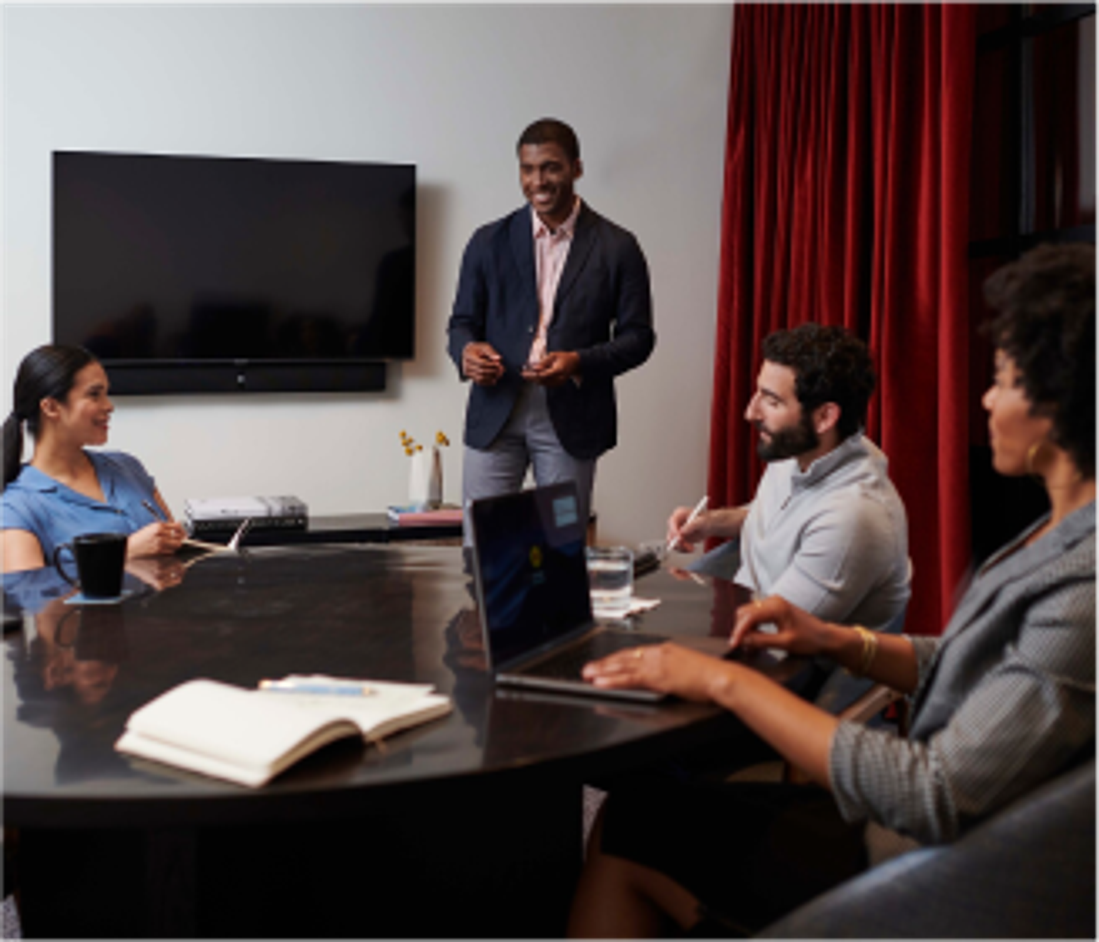 smiling employees in a meeting