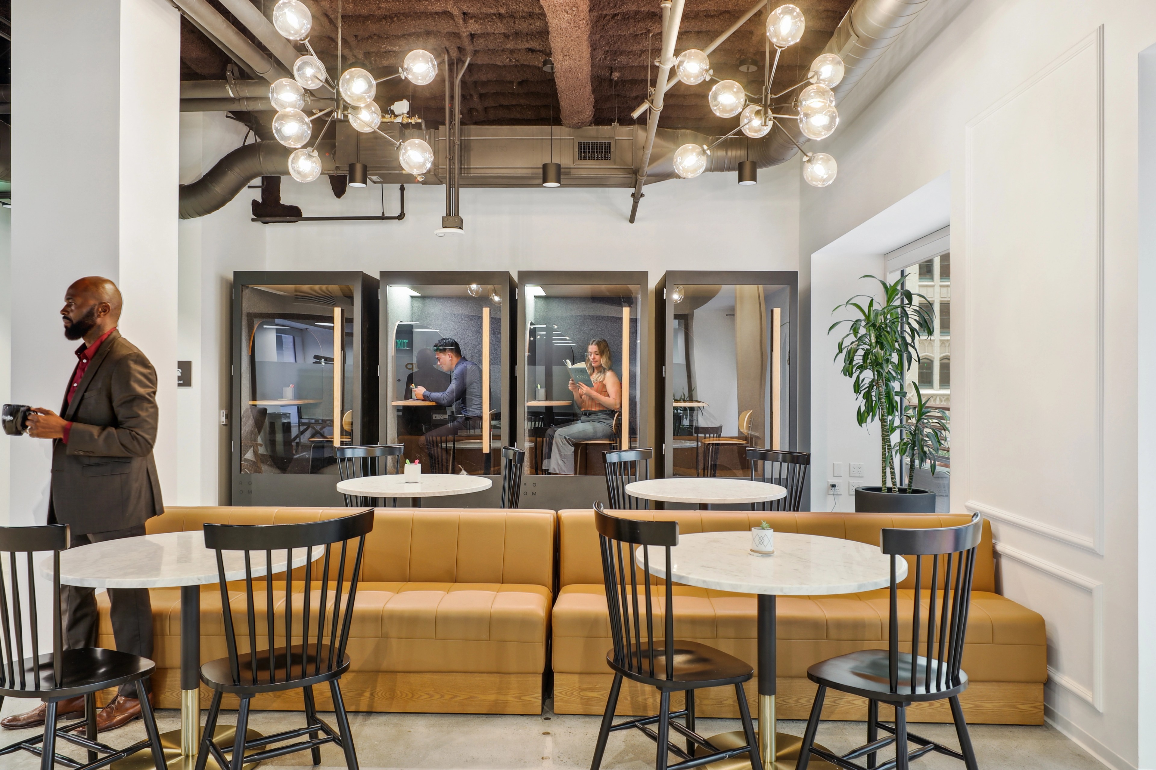 Interior view of 333 Bush with cafe-style tables and chairs