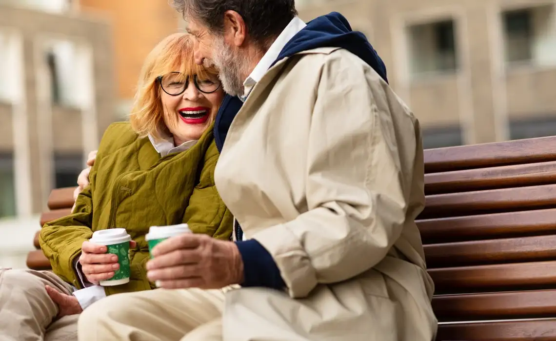Couple enjoys coffee outside the Residences at Mazza