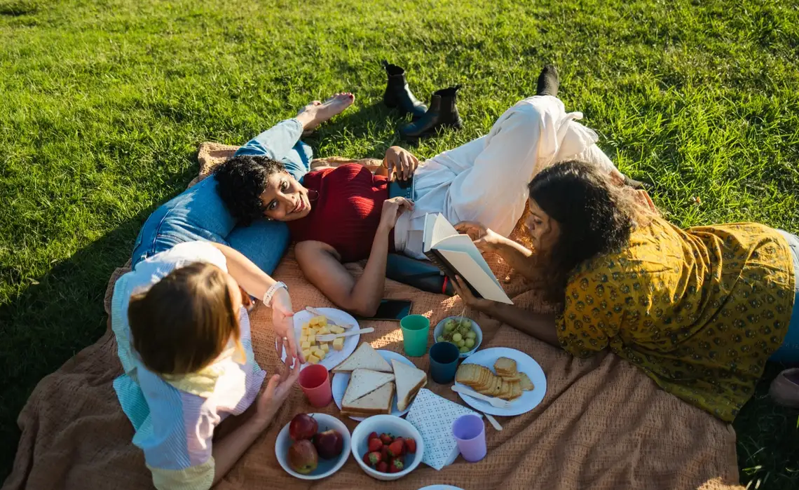 Friends relax and picnic in the park in their Washington, DC neighborhood