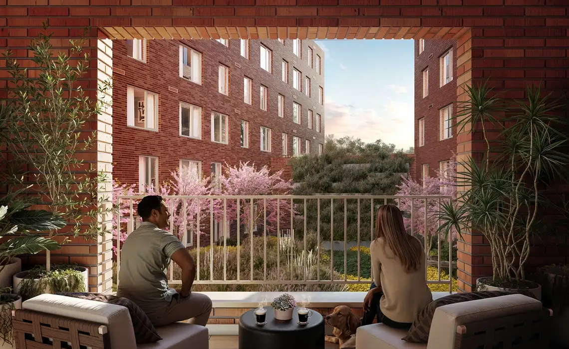 Couple enjoy their outdoor patio at Residences at Mazza
