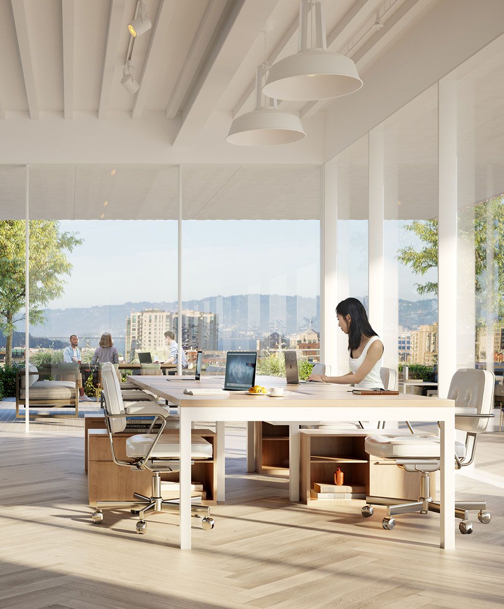  modern Brannan Square office interior featuring a large white collaborative table and light-colored flooring