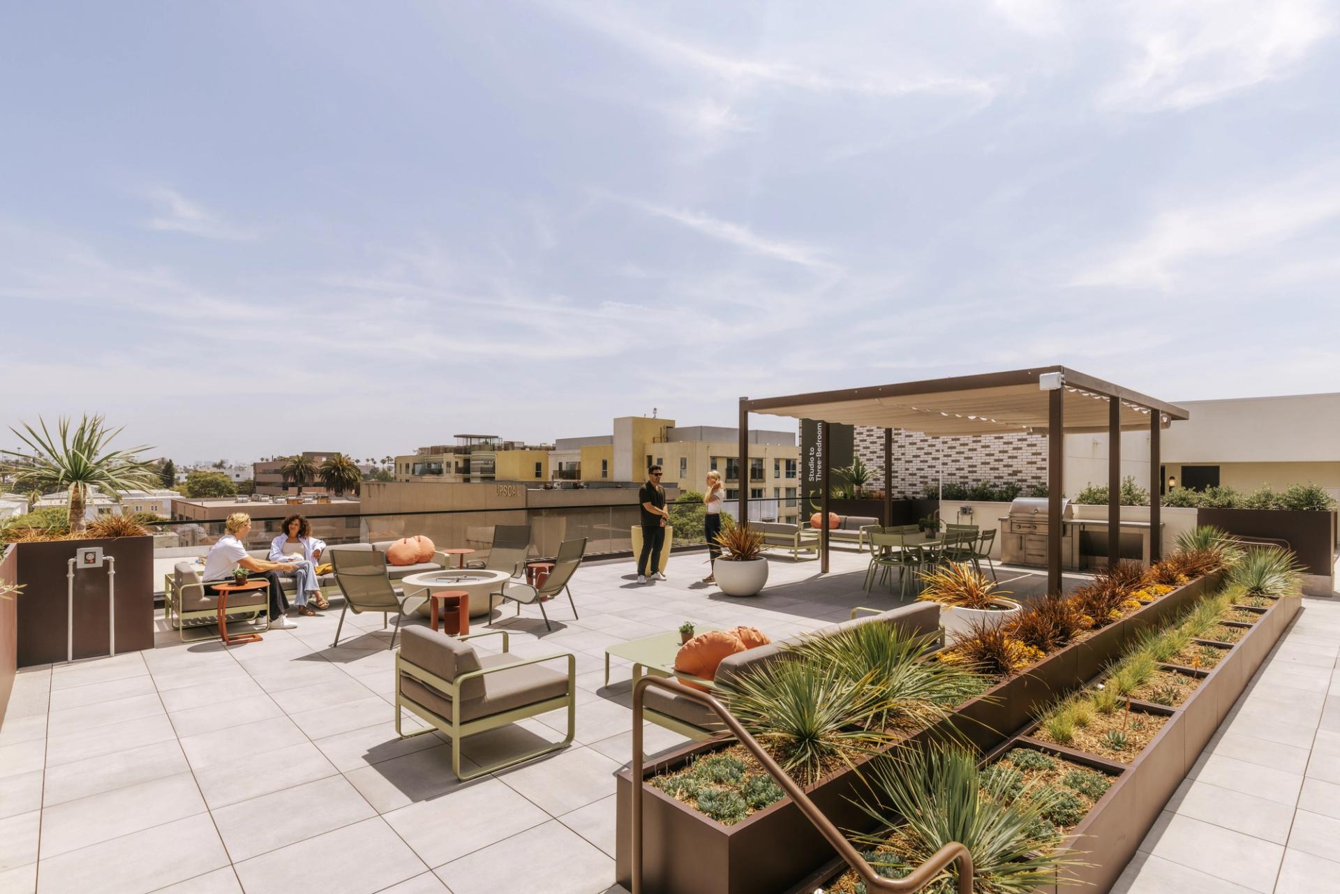 A rooftop retreat with comfortable gathering spaces and sweeping ocean views, designed for relaxing, connecting, and taking in the California coastline