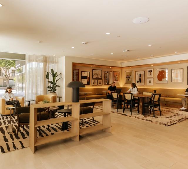 Lobby coworking lounge with ample seating and private workspaces