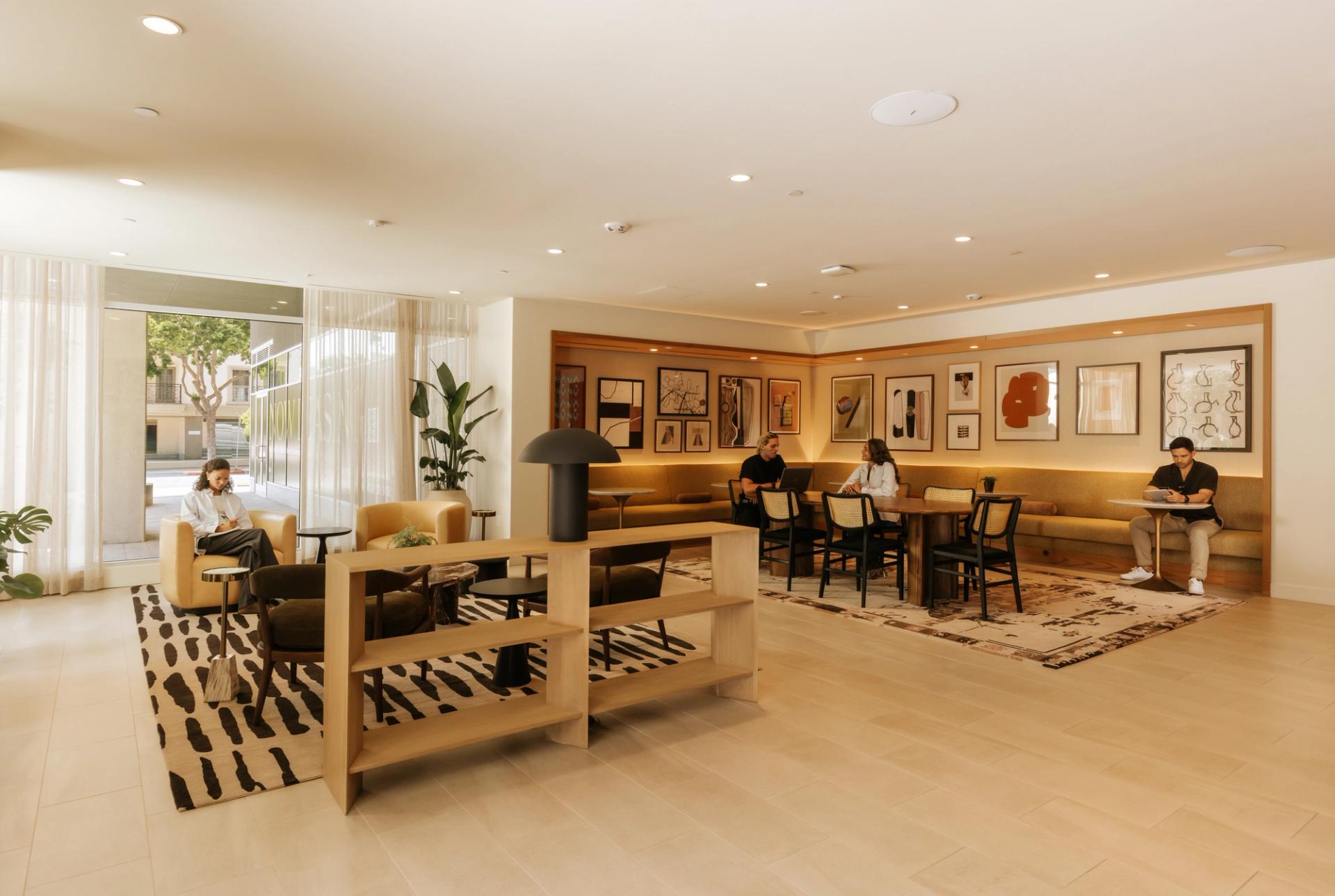 Lobby coworking lounge with ample seating and private workspaces