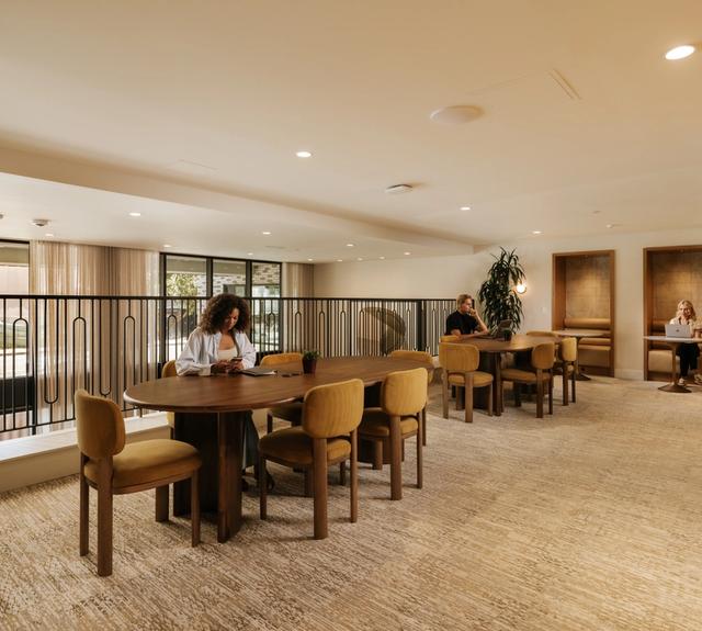 Productive coworking lounge with ample seating and private workspaces