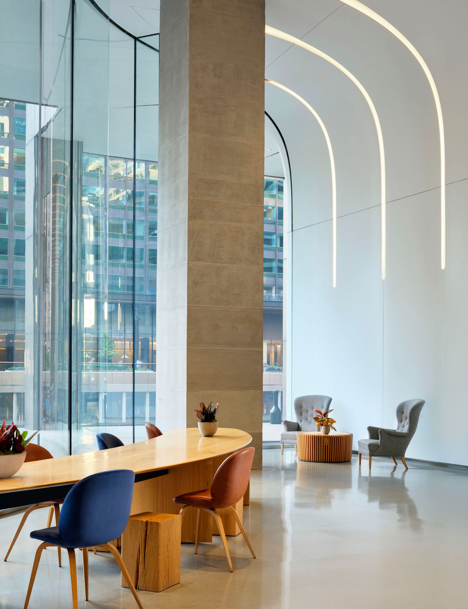 A 24-foot wavelike glass facade draws light deep into the building, softening the boundary between Wacker Drive and the space within. At 20,000 square feet across two towers, you'll feel the difference the moment you walk in.