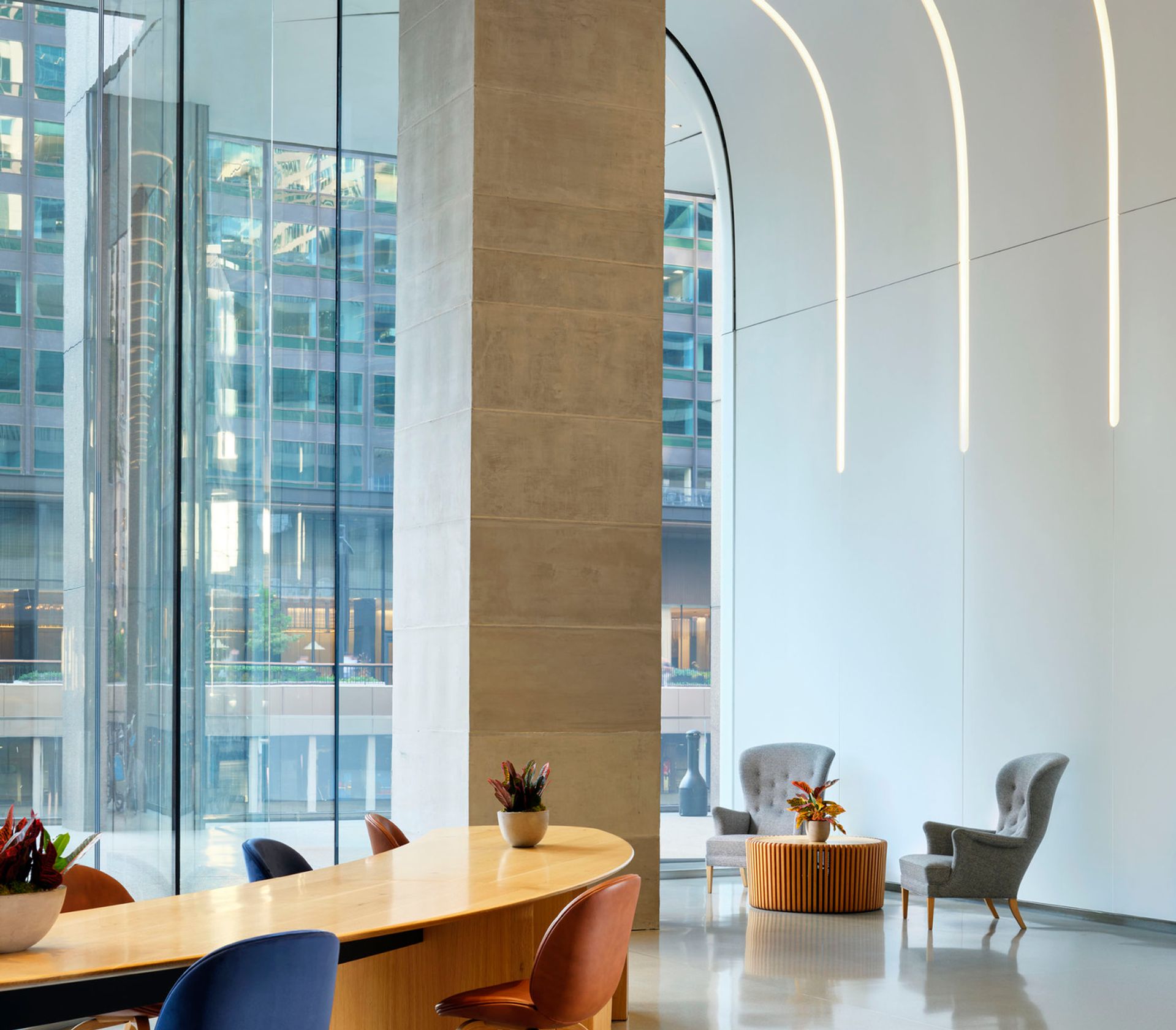 A 24-foot wavelike glass facade draws light deep into the building, softening the boundary between Wacker Drive and the space within. At 20,000 square feet across two towers, you'll feel the difference the moment you walk in.