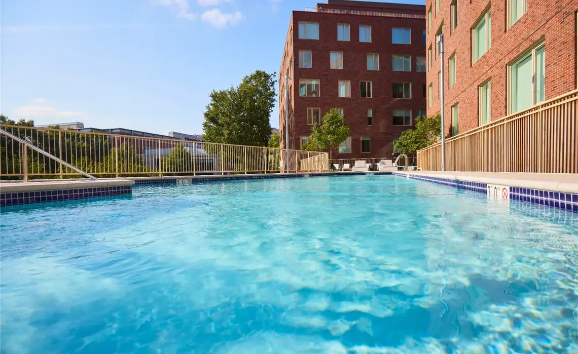 Rendering of residents enjoying the outdoor pool at Residences at Mazza