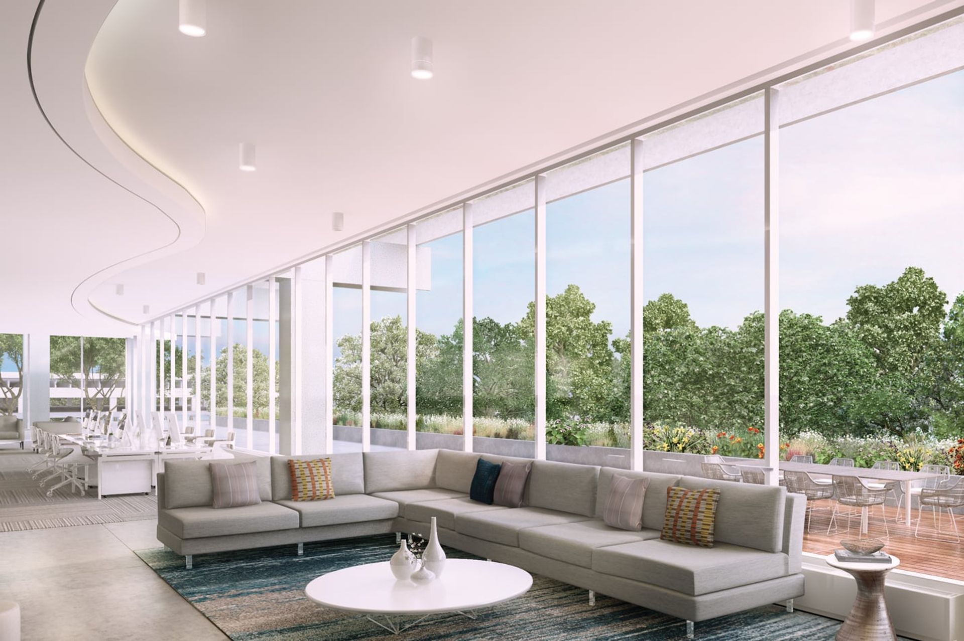 A modern living room with a large, curved ceiling, white walls, and a large window overlooking a garden, featuring a gray sectional sofa, white coffee table, and a blue rug. Greenwich American Center