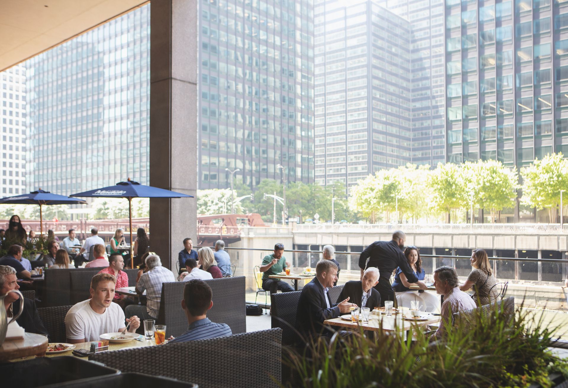 This is Rivers Restaurant, an American eatery located in Chicago's CME Center with a scenic outdoor deck overlooking the river.