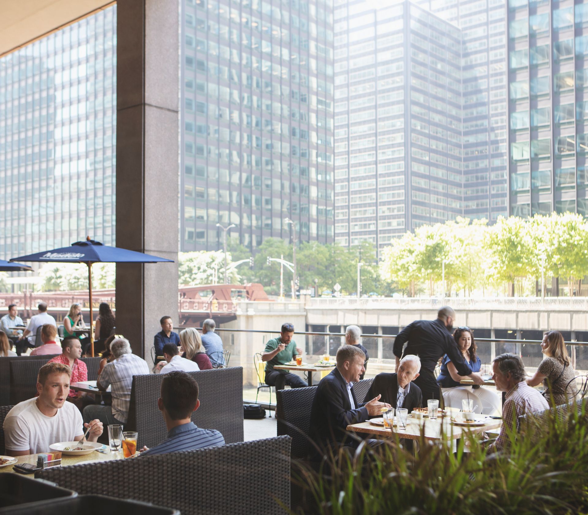 This is Rivers Restaurant, an American eatery located in Chicago's CME Center with a scenic outdoor deck overlooking the river.