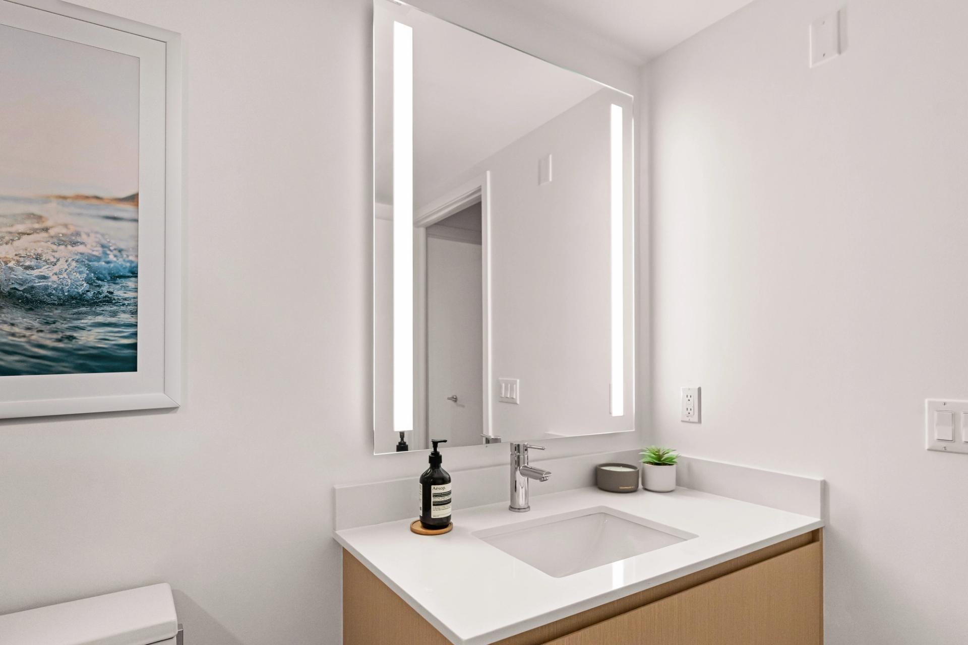 Refined vanities with integrated lighting and clean lines