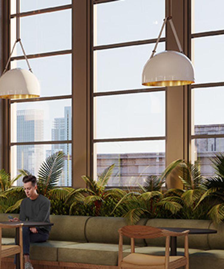 Modern-looking cafe with large windows showcasing a city view.