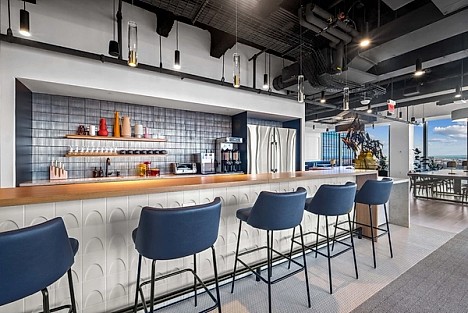 A view of the kitchen counter with bar stools
