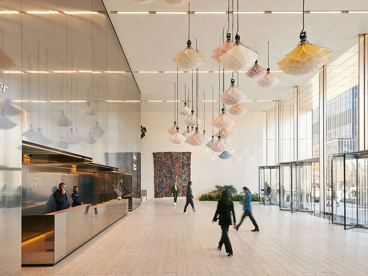 An image of a building lobby with people