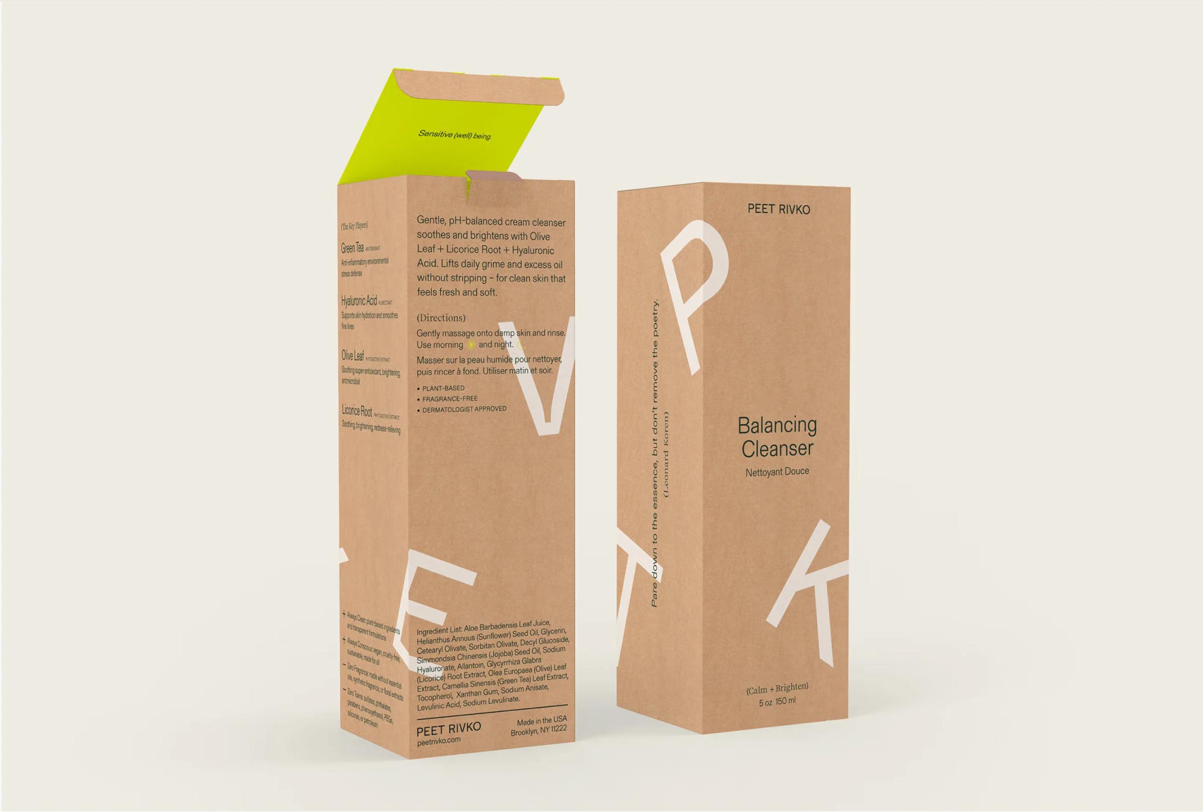 Brown cardboard packaging for Balancing Cleanser features white text and a vibrant green flap, highlighting key ingredients.