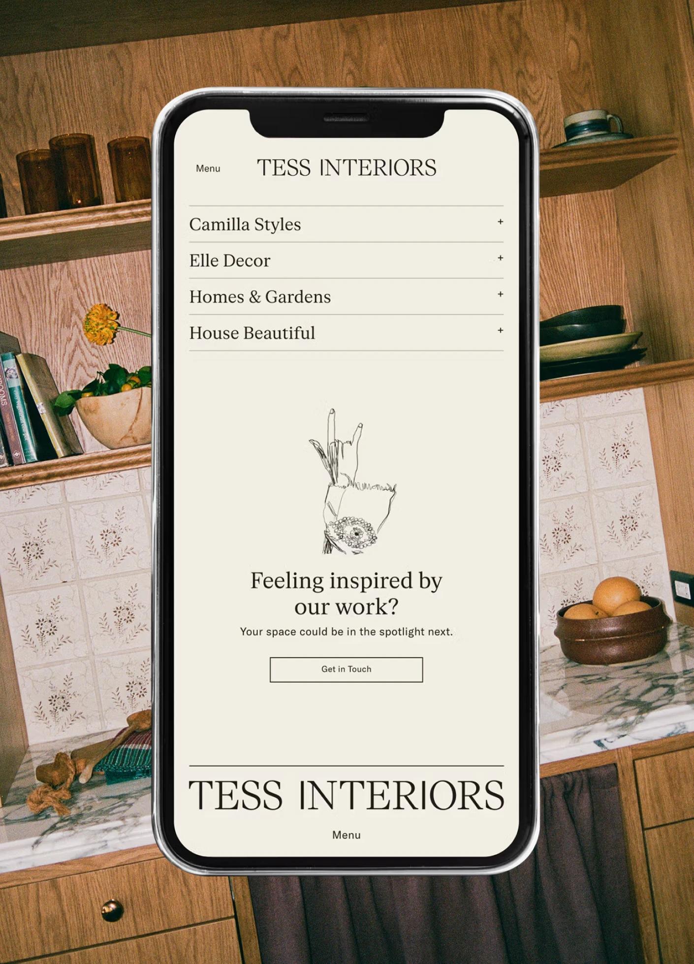 Mobile screen displaying design services for "Tess Interiors," featuring menu options and a call to action.