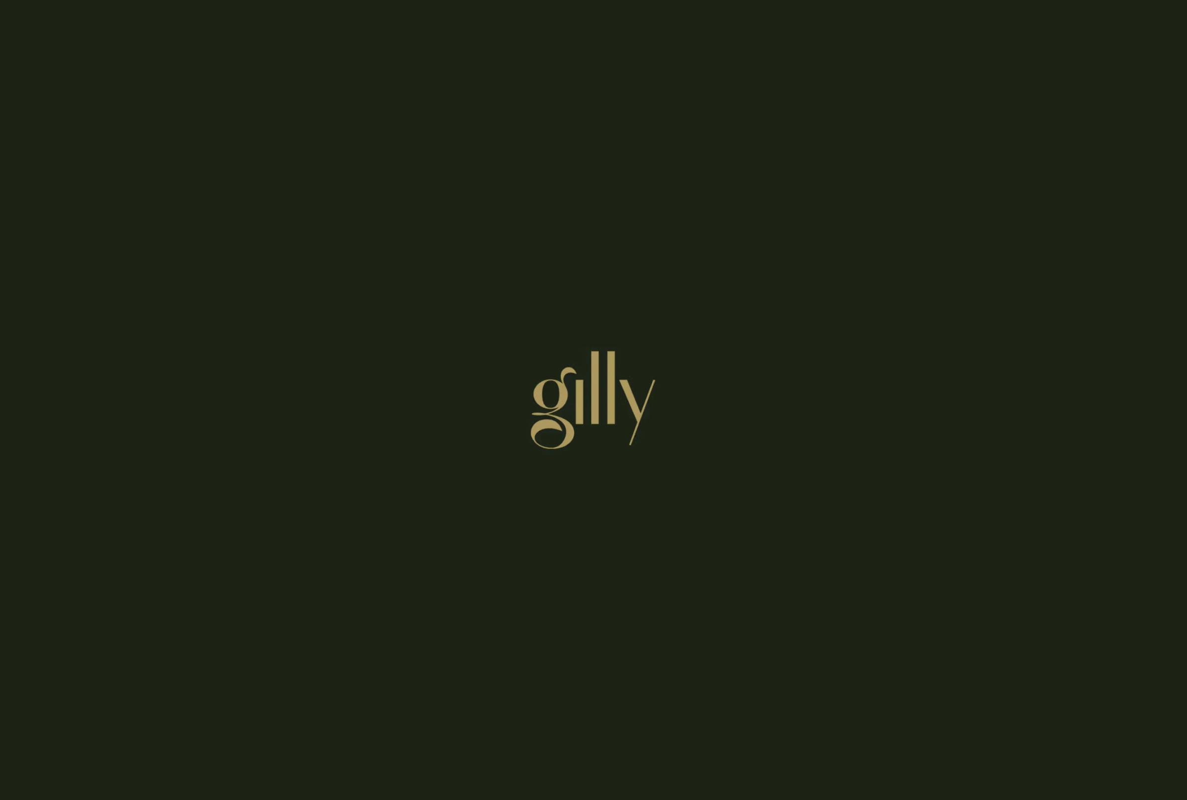 Elegant gold text spelling "gilly" centered on a dark green background.