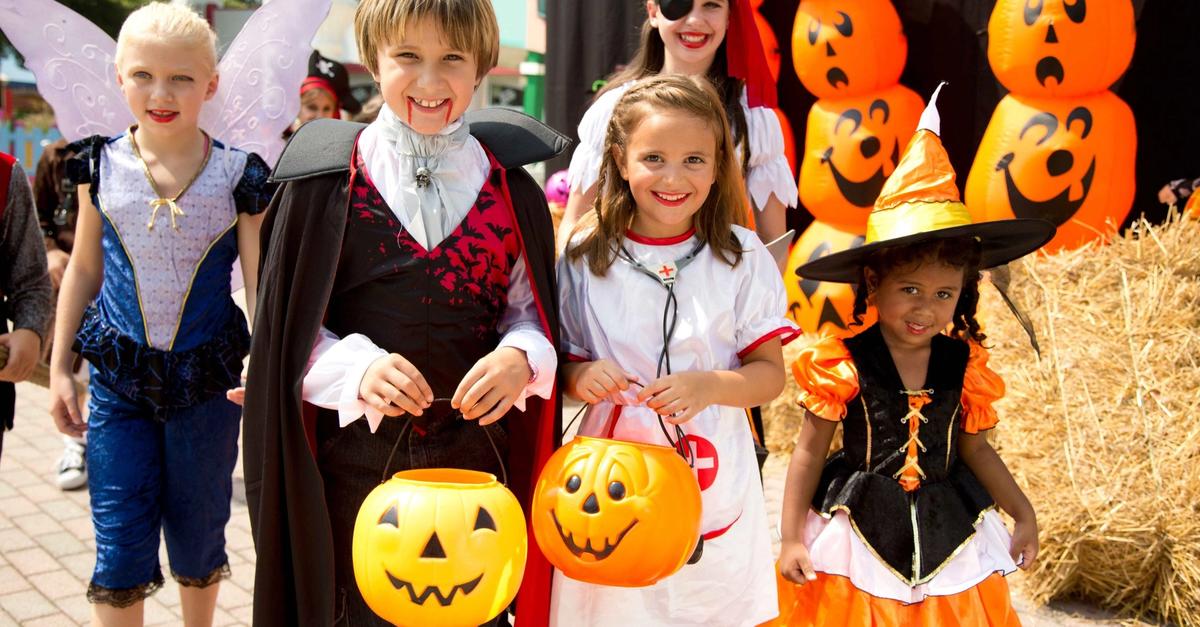 Children trick-or-treating in costume at Six Flags Magic Mountain's Tricks and Treats event