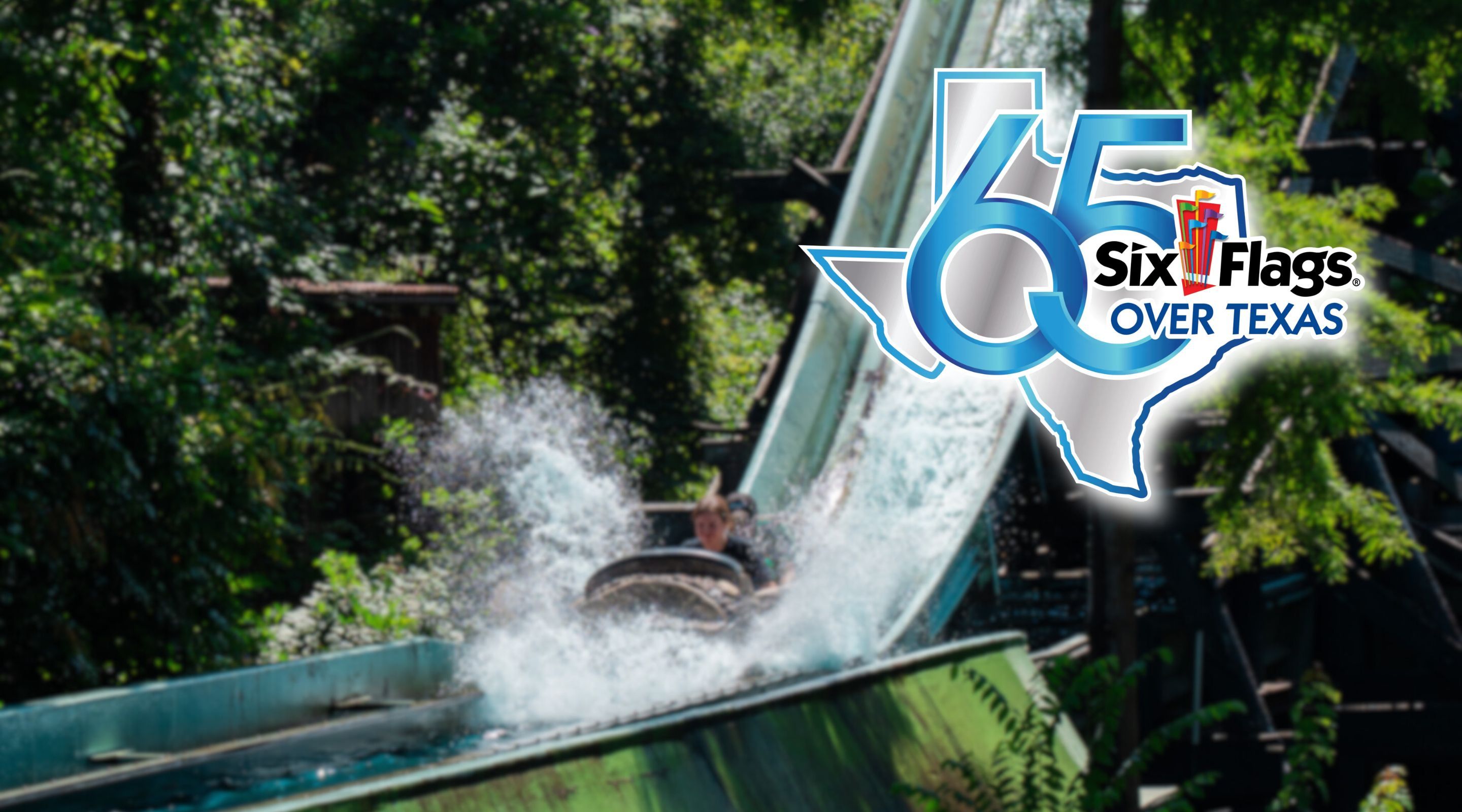 Six Flags Over Texas 65th anniversary logo over a log flume splashdown