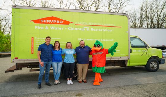 Dorney Park and community partners stand beside a SERVPRO truck during the Squishmallows donation pickup