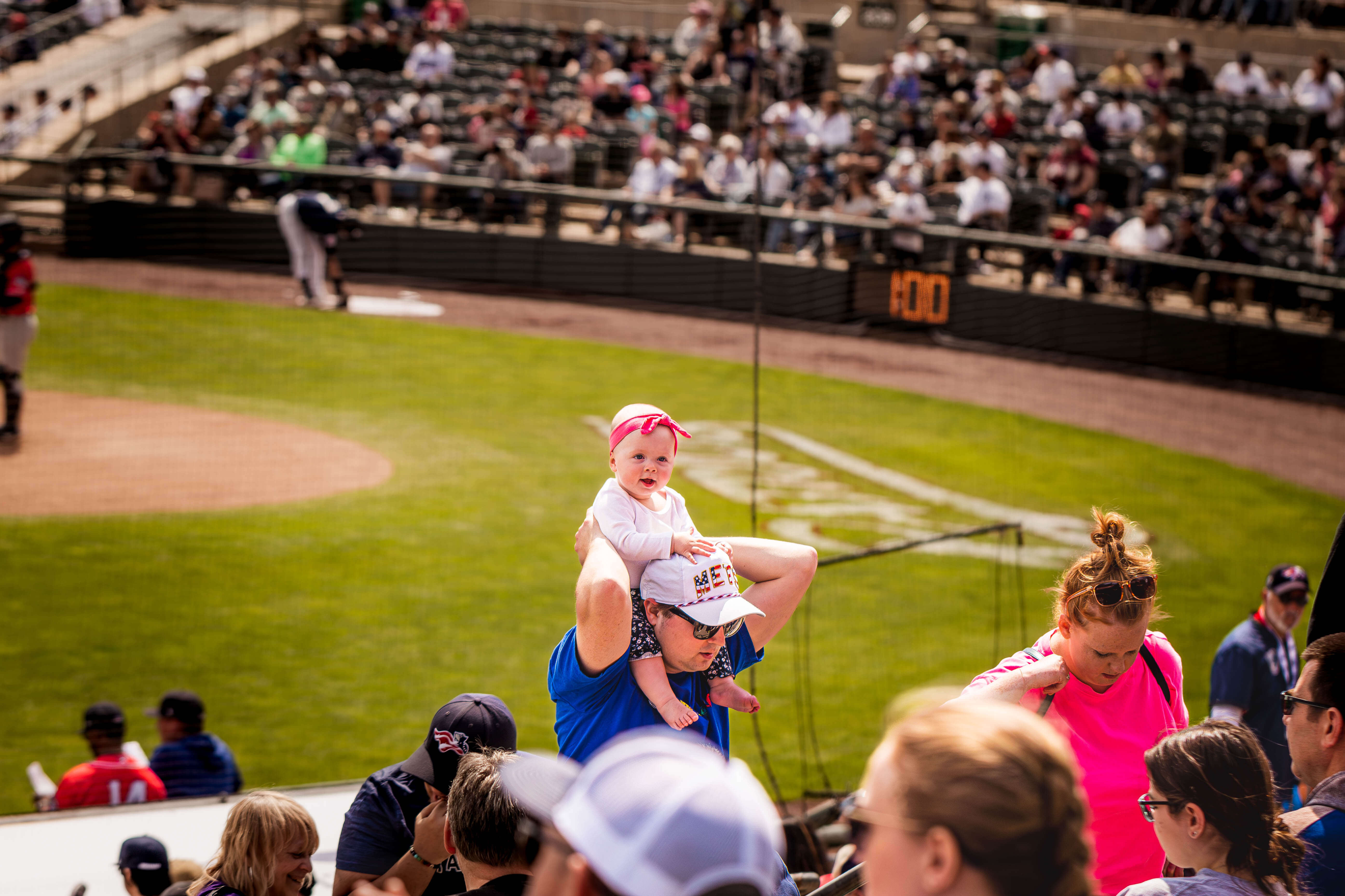 photo of a baby at a baseball game