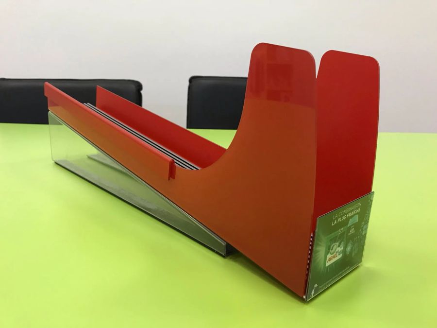 Red Ariel gravity-feed shelf display rack