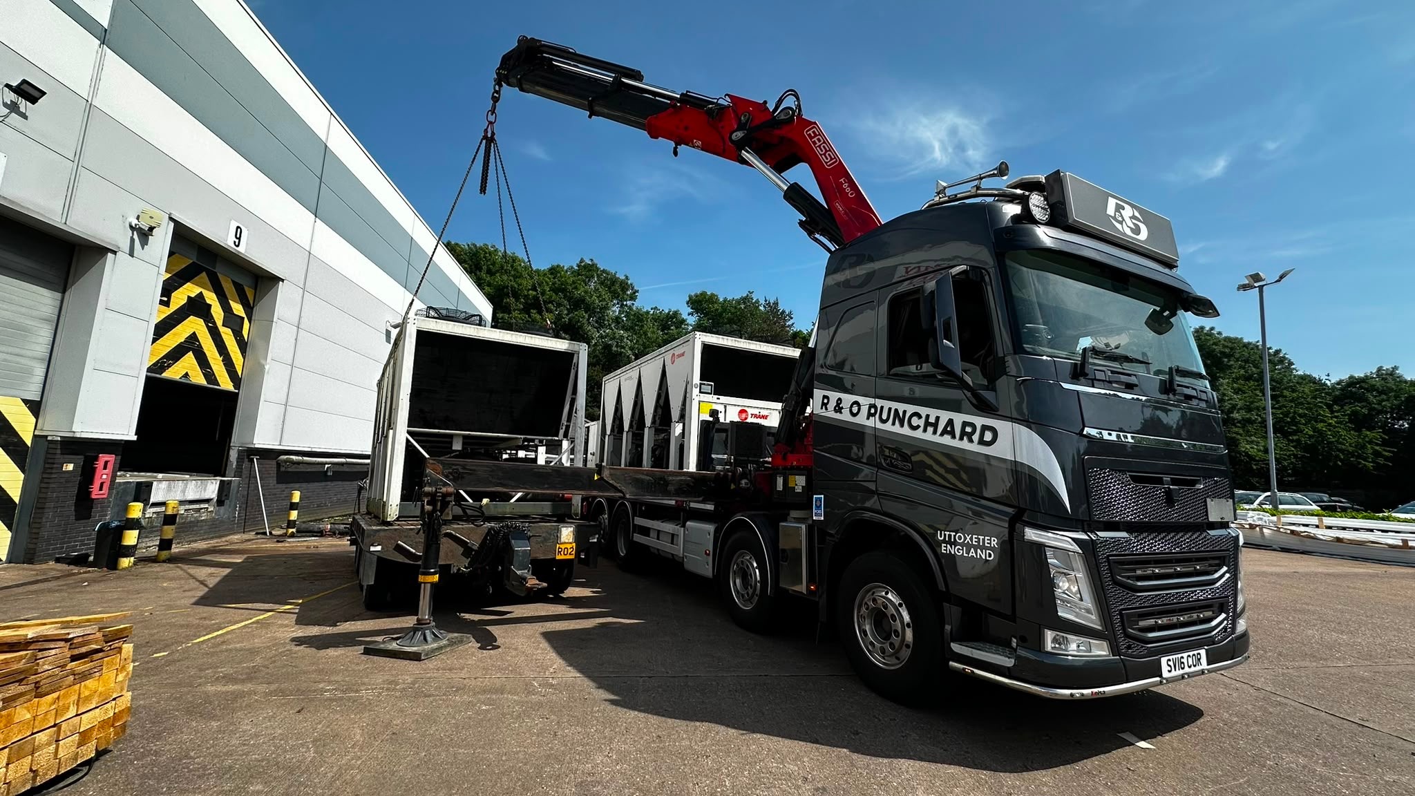 R&O Punchard HIAB crane lorry lifting a load outside an industrial unit
