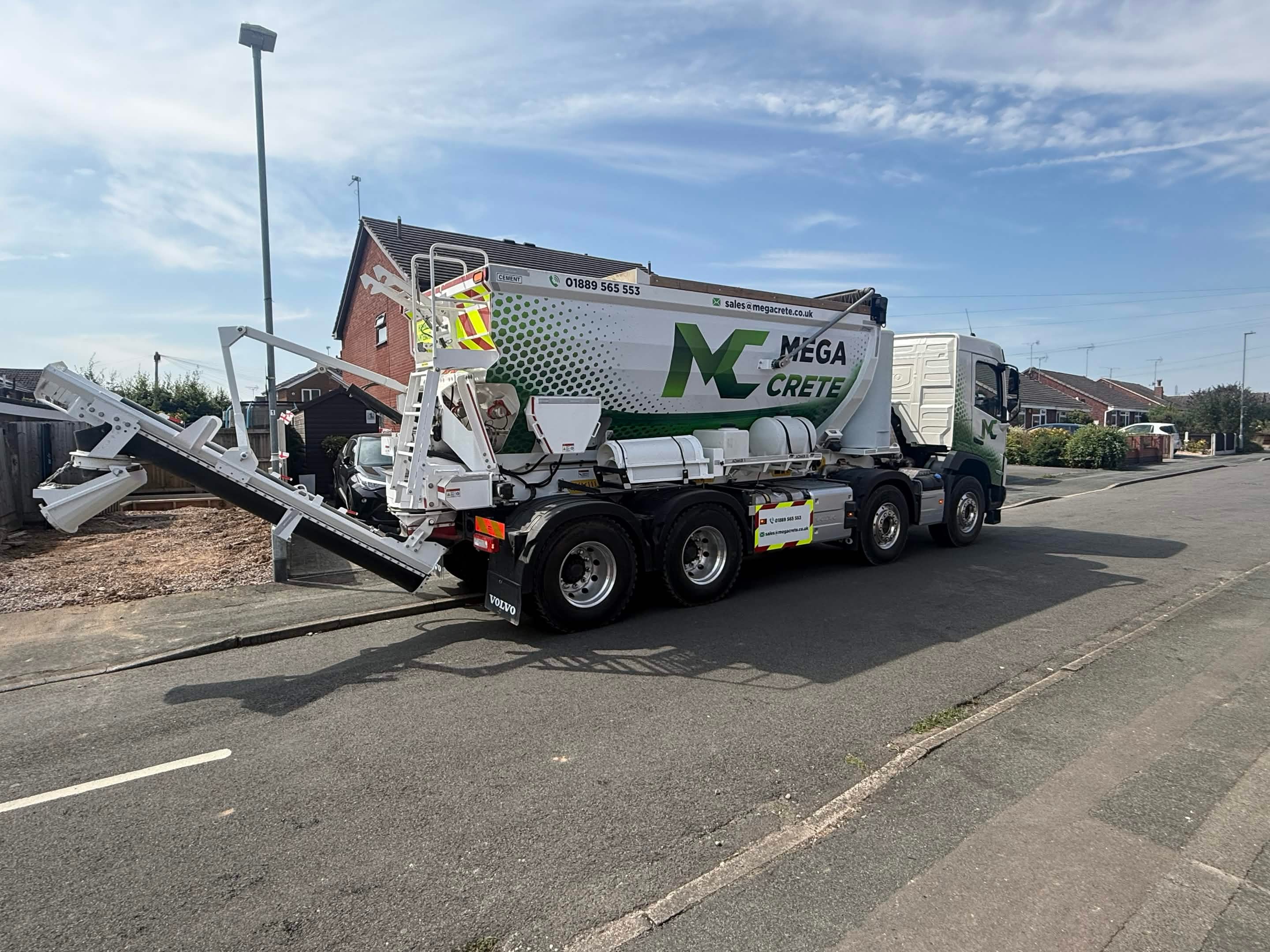 Mega Crete volumetric concrete lorry parked on a residential street