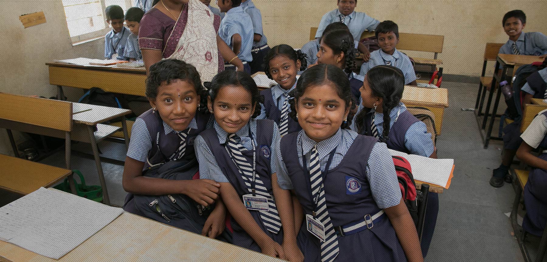 Pupils sitting together in a classroom at a DFN-supported school